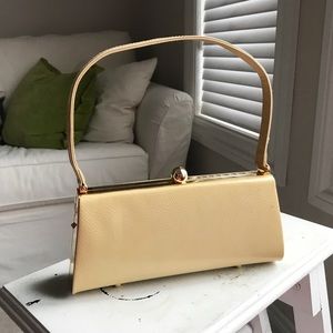 Pale yellow textured patent structured rigid evening bag